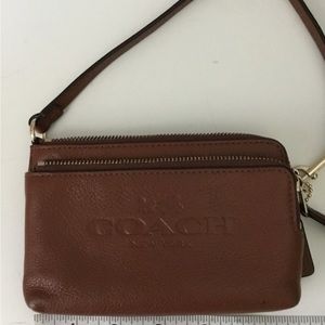 Coach brown leather wristlet,actually fits over shoulder